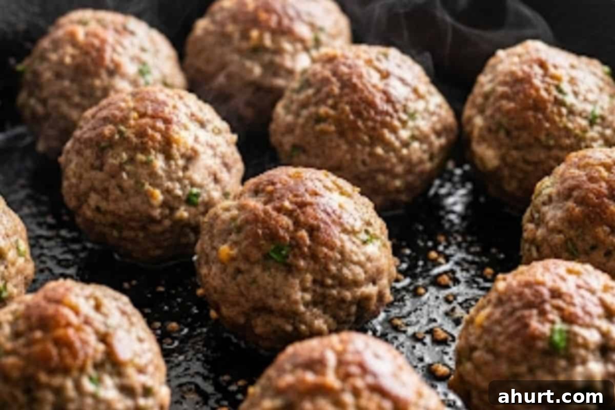 Irresistible Cheesy Meatballs 8 Brown meatballs on all sides, then transfer to a warm plate.