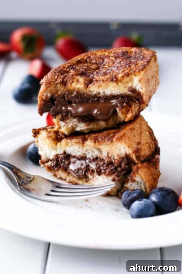 Nutella Stuffed Churro French Toast pieces on a plate