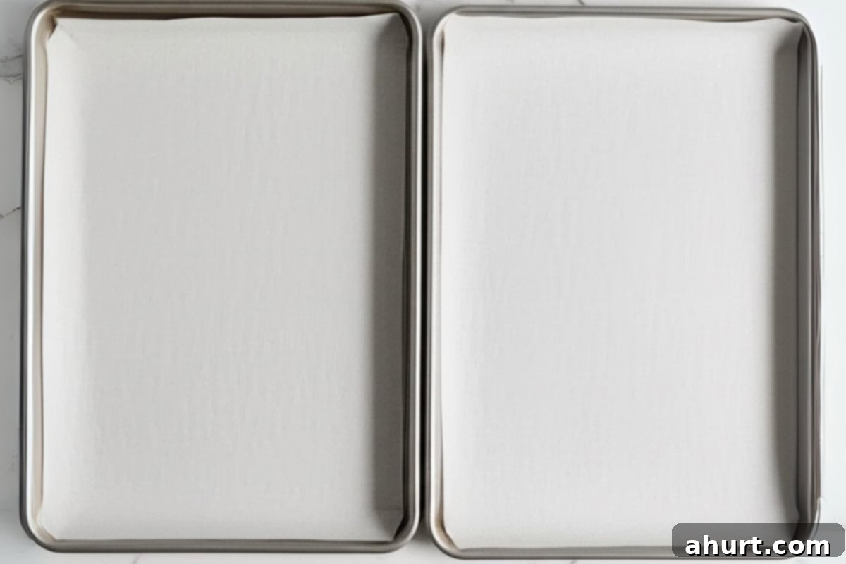 Pillowy Peanut Butter Bliss 4 line two large baking sheets with parchment paper