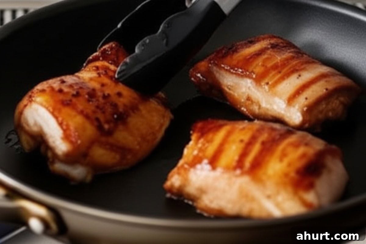 Honey Sriracha Glazed Chicken 7 Sear 3 chicken thighs at a time to ensure proper browning and cooking.