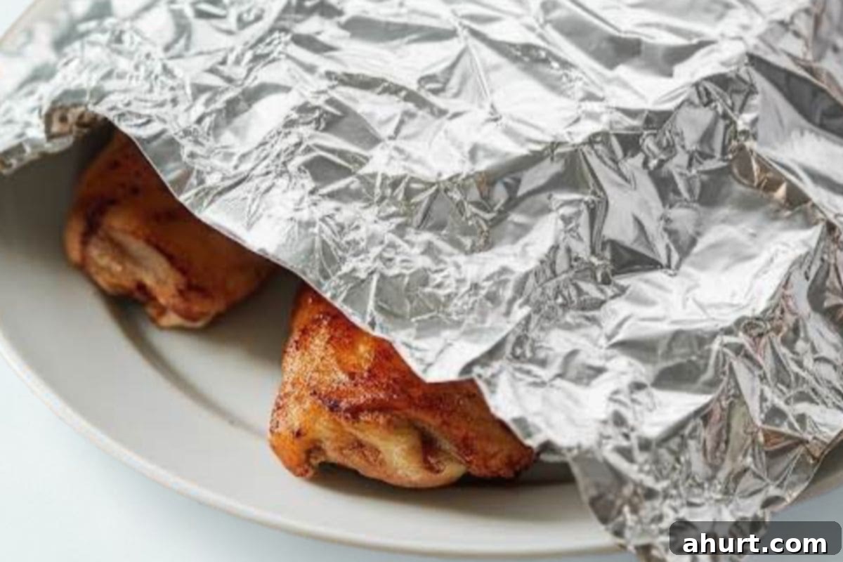 Honey Sriracha Glazed Chicken 8 Transfer the cooked chicken onto a warm plate, tent it with foil, and allow it to rest.