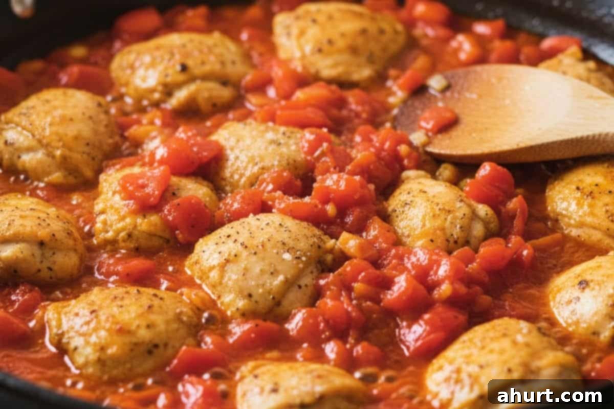 Paella Perfection 5 Add the chicken thigh pieces and cook until golden on all sides. Stir in the chopped tomatoes, season with salt and pepper.