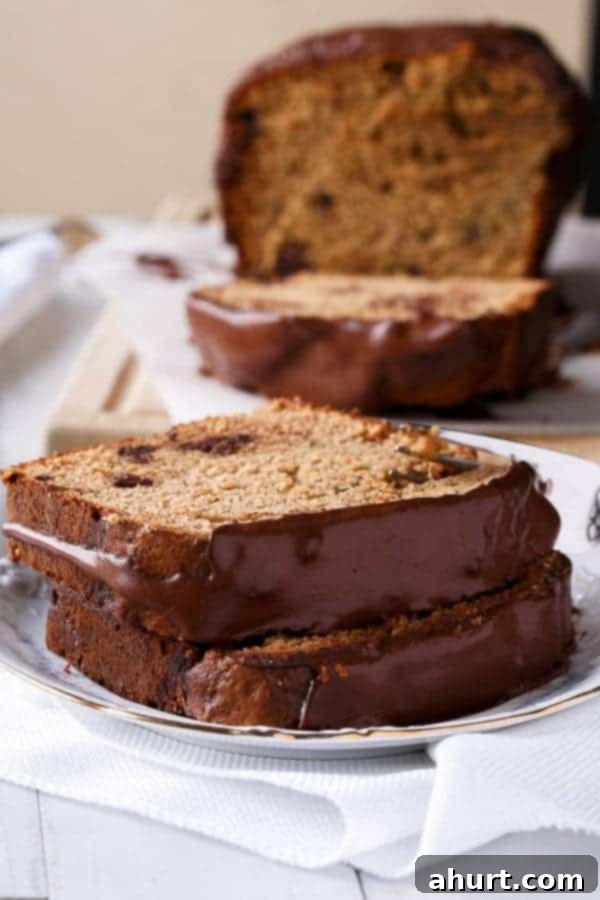 Side view image of Peanut Butter Chocolate Chip Banana Bread slices on a plate