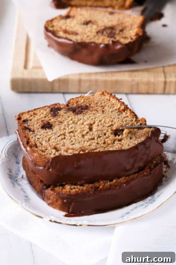 Two slices of Peanut Butter Chocolate Chip Banana Bread on a plate