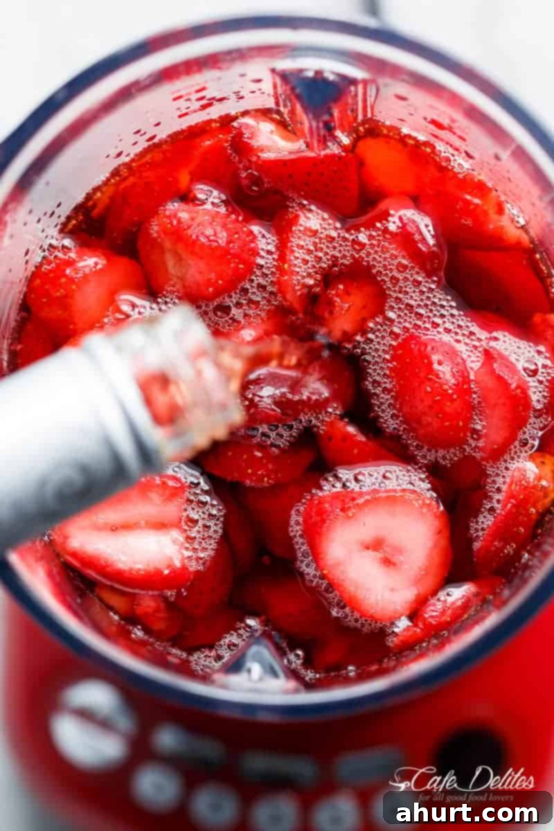 Frozen Strawberry Rosé 4 Add some liquid into fresh strawberry pieces in a glass