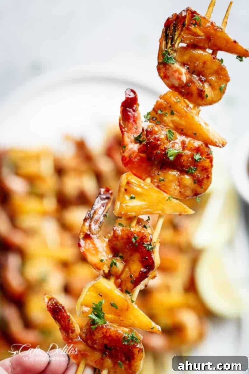 Honey Garlic Glazed Shrimp & Pineapple Skewers 2 Honey Garlic Butter Shrimp Pineapple Skewers are cooked with honey garlic butter sauce!