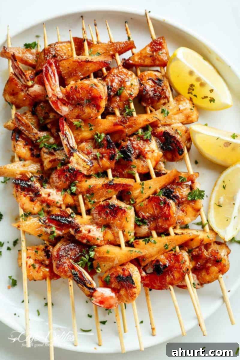 Honey Garlic Glazed Shrimp & Pineapple Skewers 4 Honey Garlic Butter Shrimp Pineapple Skewers are cooked in the most incredible honey garlic butter sauce on a plater