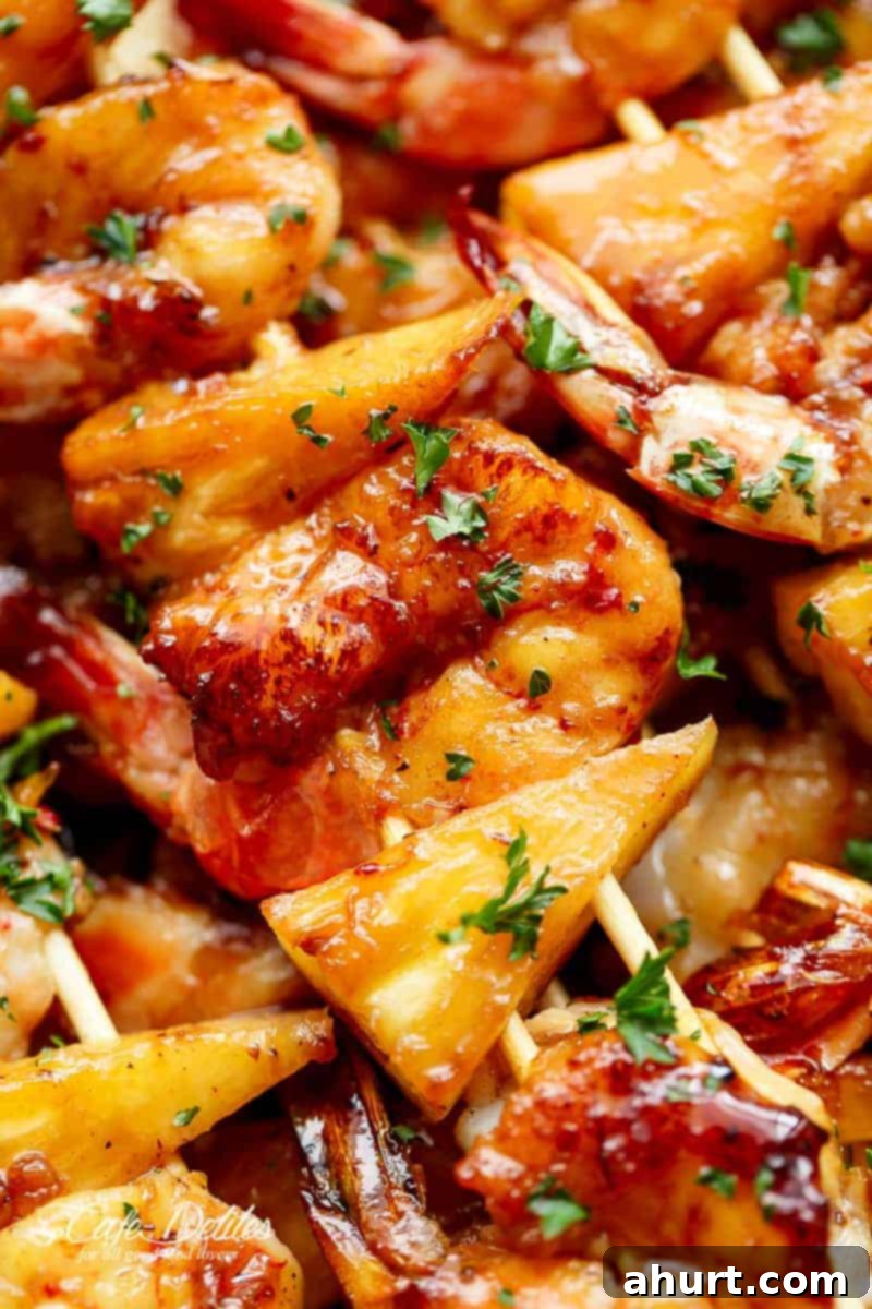 Honey Garlic Glazed Shrimp & Pineapple Skewers 5 Zoom in image focusing on pineapple pieces from Shrimp Pineapple Skewers cooked in honey garlic butter sauce