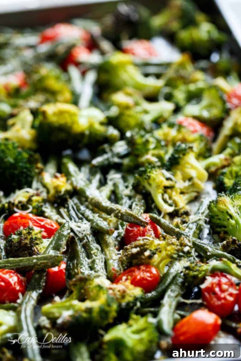 One-Pan Garlic Parmesan Roasted Broccoli and Green Beans 4 Focusing on asparagus piece from Sheet Pan Garlic Parmesan Roasted Broccoli & Green Beans