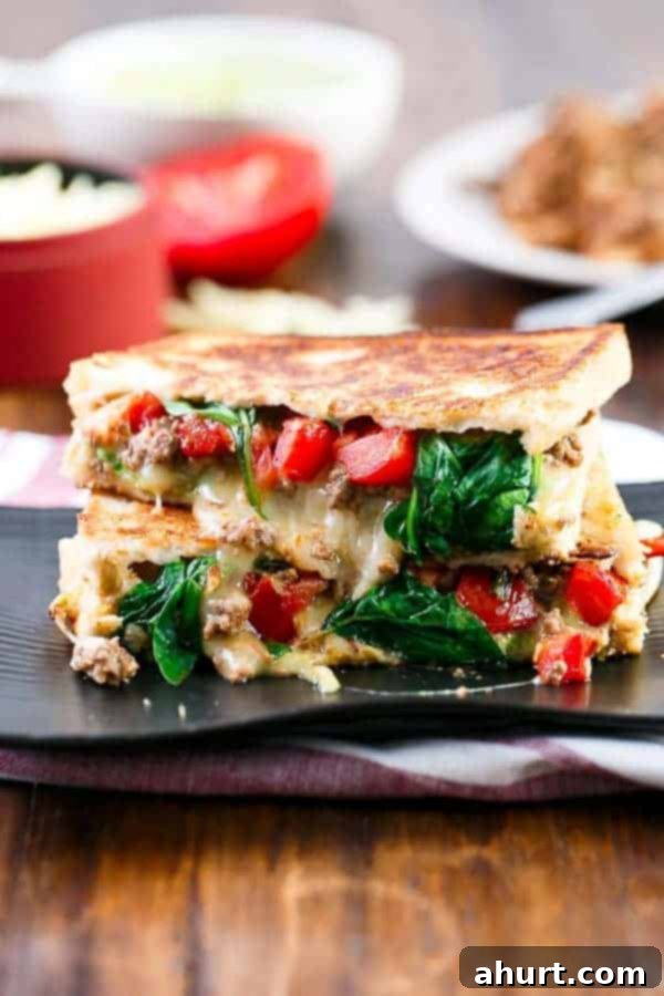 Loaded Taco Grilled Cheese sandwich on a platter, showcasing its golden crust and melted cheese.