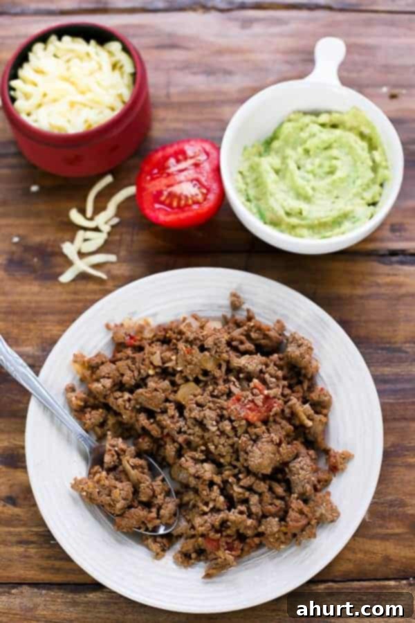 Close-up of the perfectly seasoned Loaded Taco Grilled Cheese mixture, ready to be assembled.