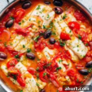 Golden Pan-Seared Fish with Mediterranean Medley 6 Pan Seared Fish With Tomatoes & Olives in a pan