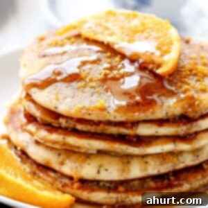Zesty Orange Poppy Seed Pancakes 12 Orange Poppyseed Pancakes being stack on each other