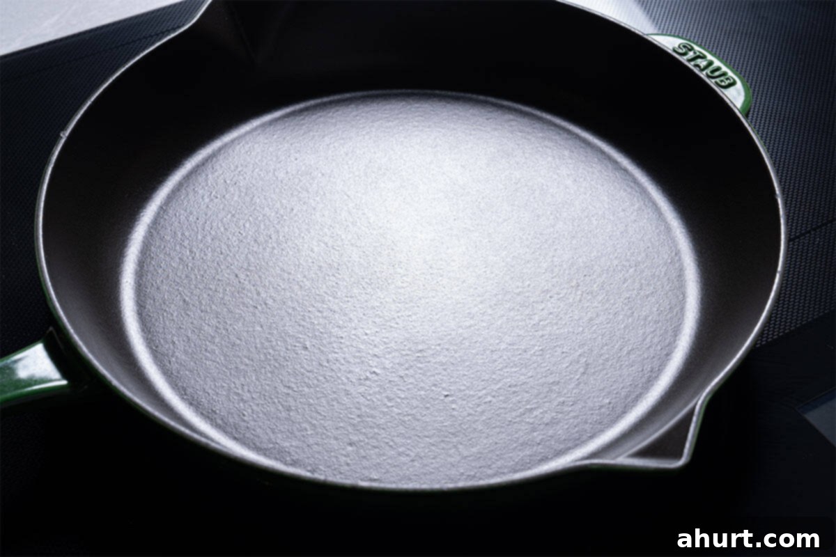 Velvety Tuscan Garlic Butter Salmon 4 Image of a skillet being heated over medium-high heat with olive oil.