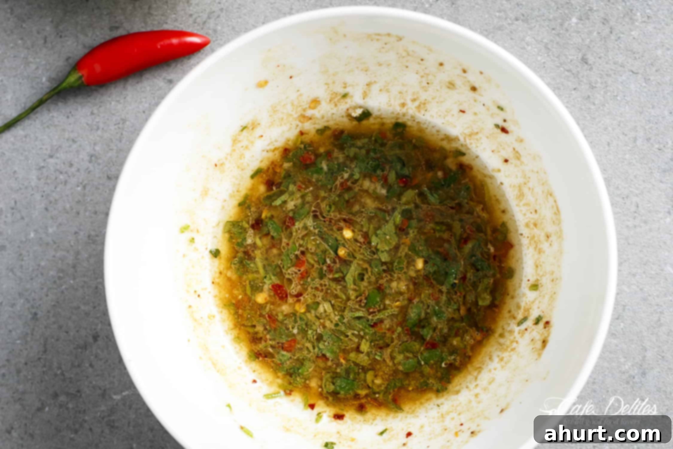 Zesty Chili Lime Cowboy Caviar 3 Cowboy Caviar Dressing in a white bowl