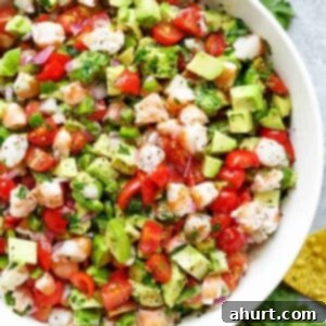 Hearty Shrimp Guacamole 5 Chunky Shrimp Guacamole pieces in a white bowl