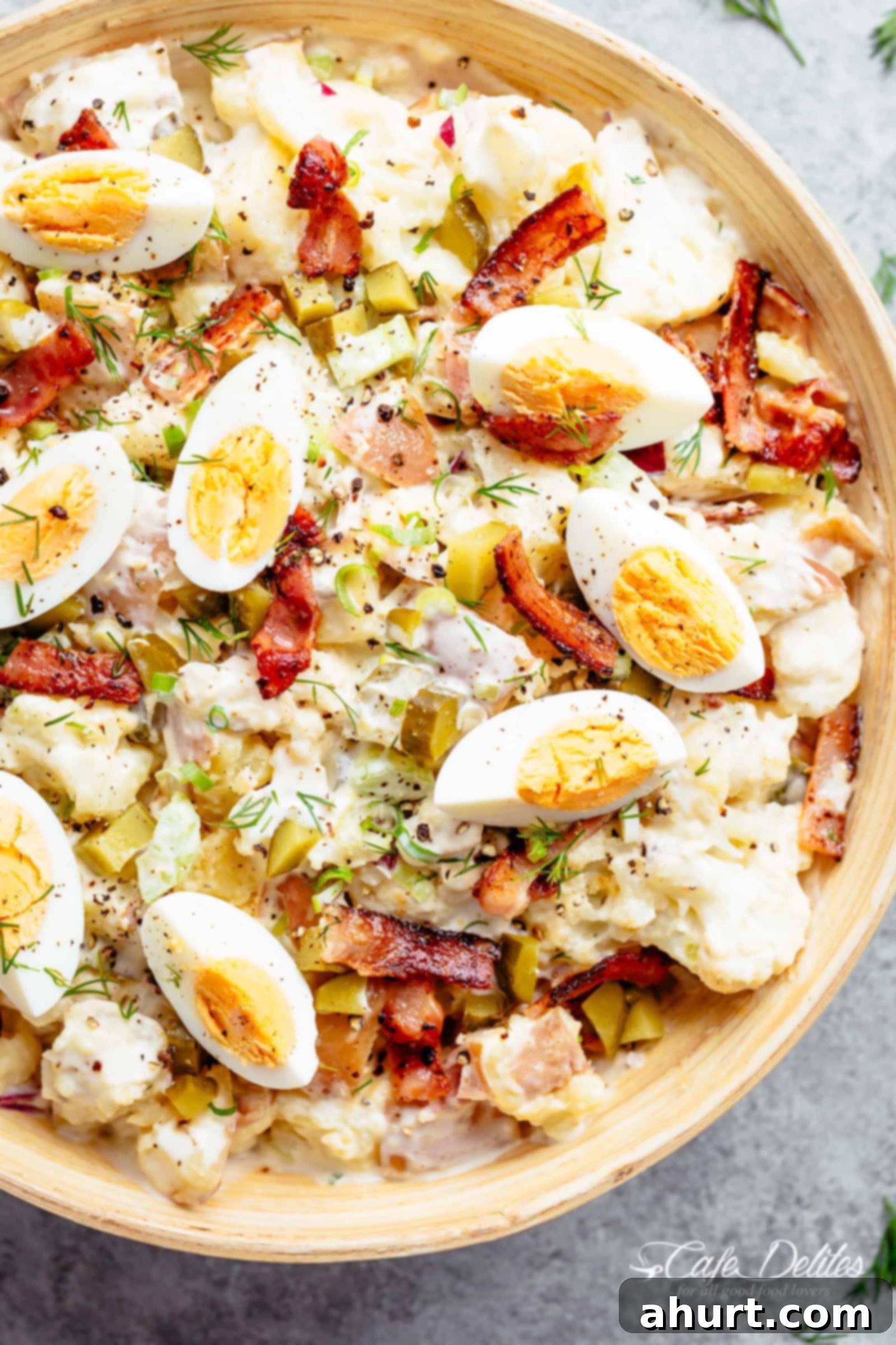 Low-Carb Potato Salad with Bacon & Dill Pickles | Easy Recipe Creamy Low-Carb Potato Salad with Bacon, Dill Pickles, and Eggs in a rustic bowl, garnished with fresh dill.