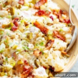 Tangy Bacon Dill Potato Salad 9 Potato Salad with Bacon, Dill Pickles, Eggs, HALF the carbs AND a creamy mayo/sour cream dressing!