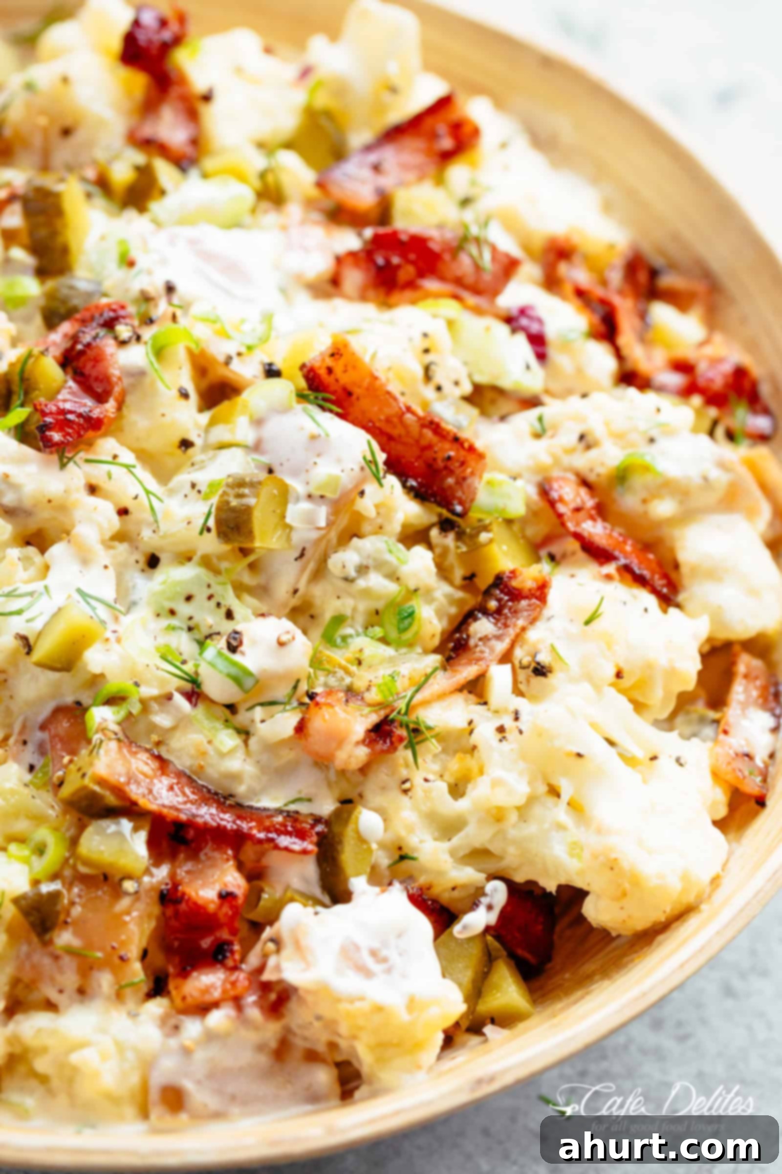 Creamy Bacon Potato Salad | Perfect Side Dish A large, rustic bowl of Potato Salad with Bacon, garnished with fresh dill and serving spoons.
