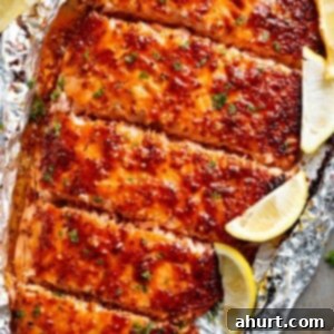 Sweet and Tangy Honey Mustard Salmon Packets 6 Garlic Butter Honey Mustard Salmon with some lemon wedges In Foil