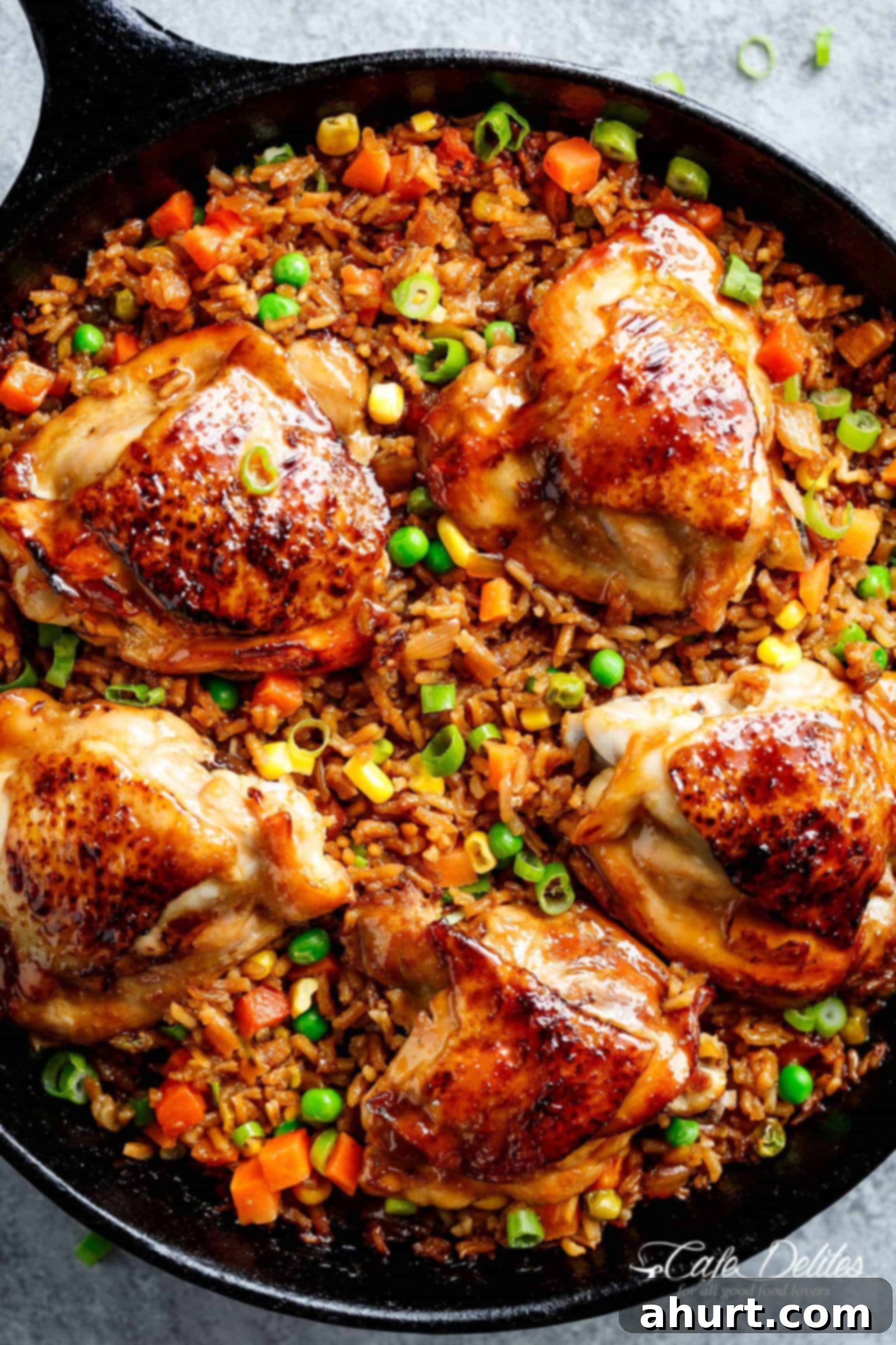 One-Pan Sticky Asian Chicken and Rice 2 One Pan Asian Chicken and Rice equals crispy skinned chicken full of incredible Chinese-inspired flavours sits on top of a fried rice inspired skillet!