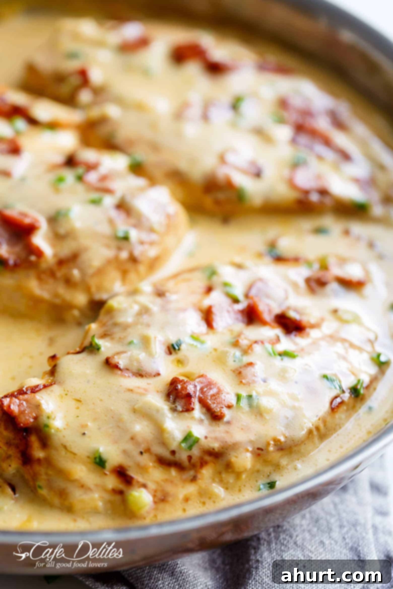 Delicious Creamy Beer Cheese Chicken With Crispy Bacon in a pan