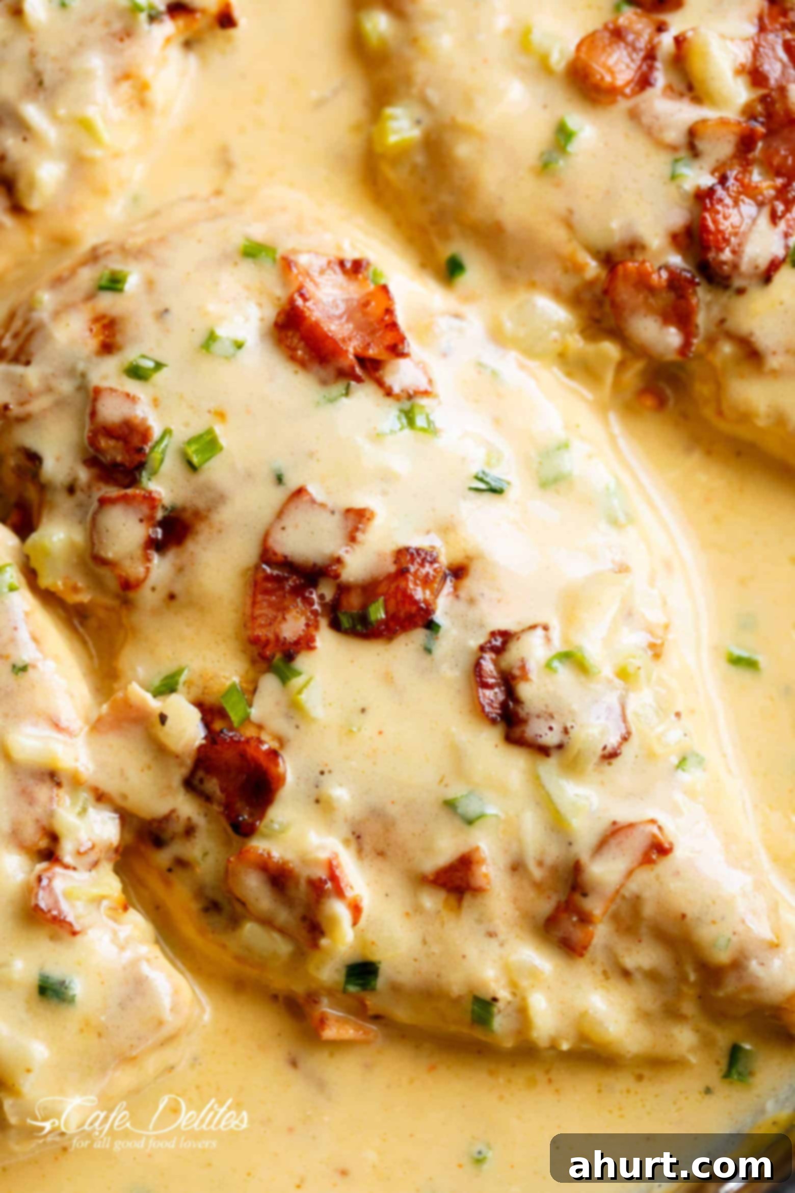 A piece of Creamy Beer Cheese Chicken With Crispy Bacon in a pan