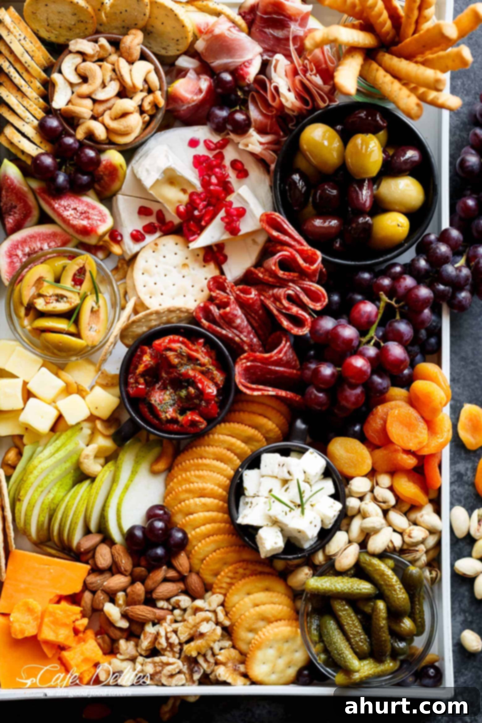 Thanksgiving Grazing Platter 2 A large platter covered with an abundant Thanksgiving charcuterie and fruits, artfully arranged for a festive holiday appetizer