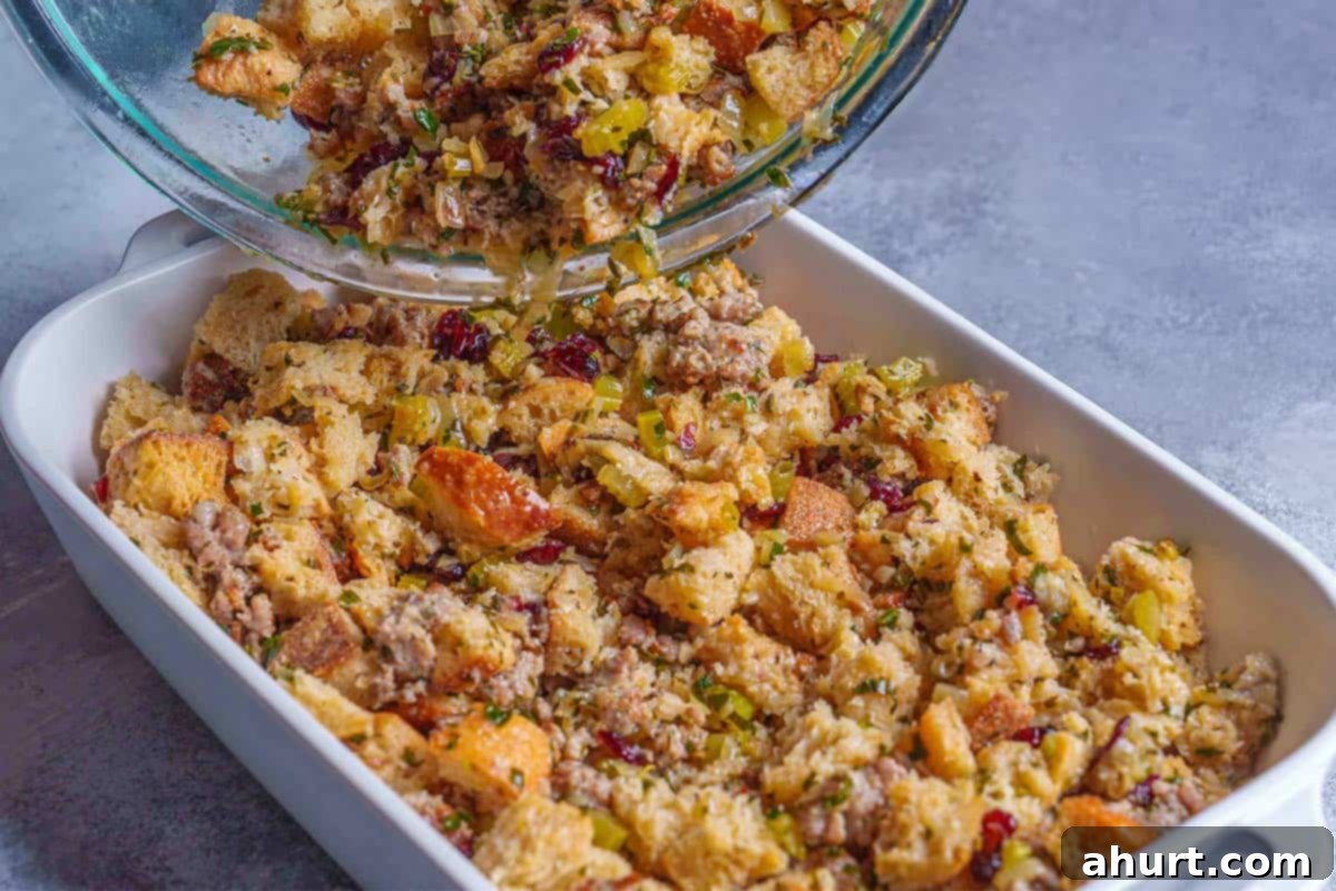 Irresistible Sausage Stuffing 9 Step 6: The image shows the stuffing being transferred to a baking dish.