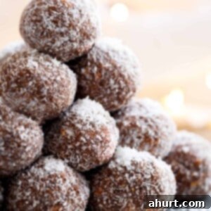 No-Bake Chocolate Rum Treats 9 Easy Chocolate Coconut Balls (Truffles) kept on each other on tray