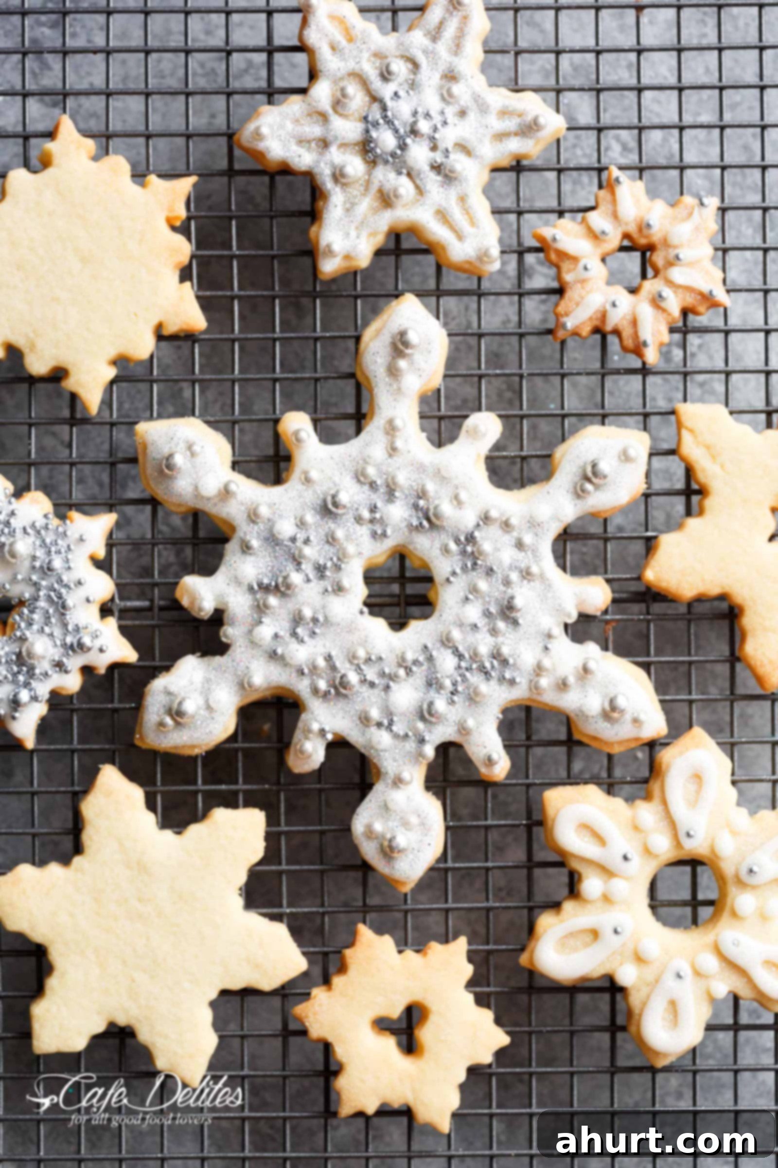 Perfect Christmas Sugar Cookies 2 Delicious, golden-brown Christmas Sugar Cookies cooling on a wire rack.