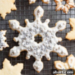 Perfect Christmas Sugar Cookies 4 Christmas Sugar Cookies Recipe ready for decorating on a cooling rack.