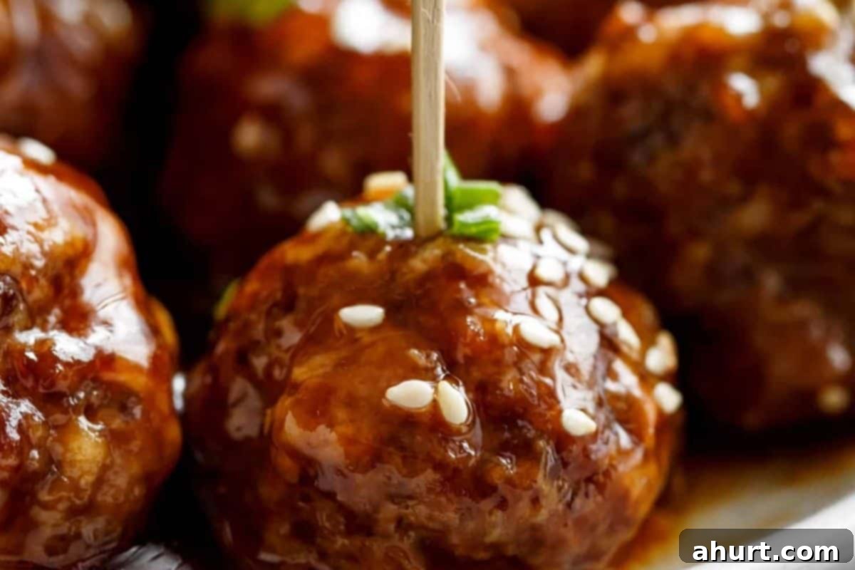Sticky Teriyaki Meatballs 9 Pour about three quarters of the sauce over the hot meatballs and toss gently to coat. Garnish with sesame seeds and green onion.