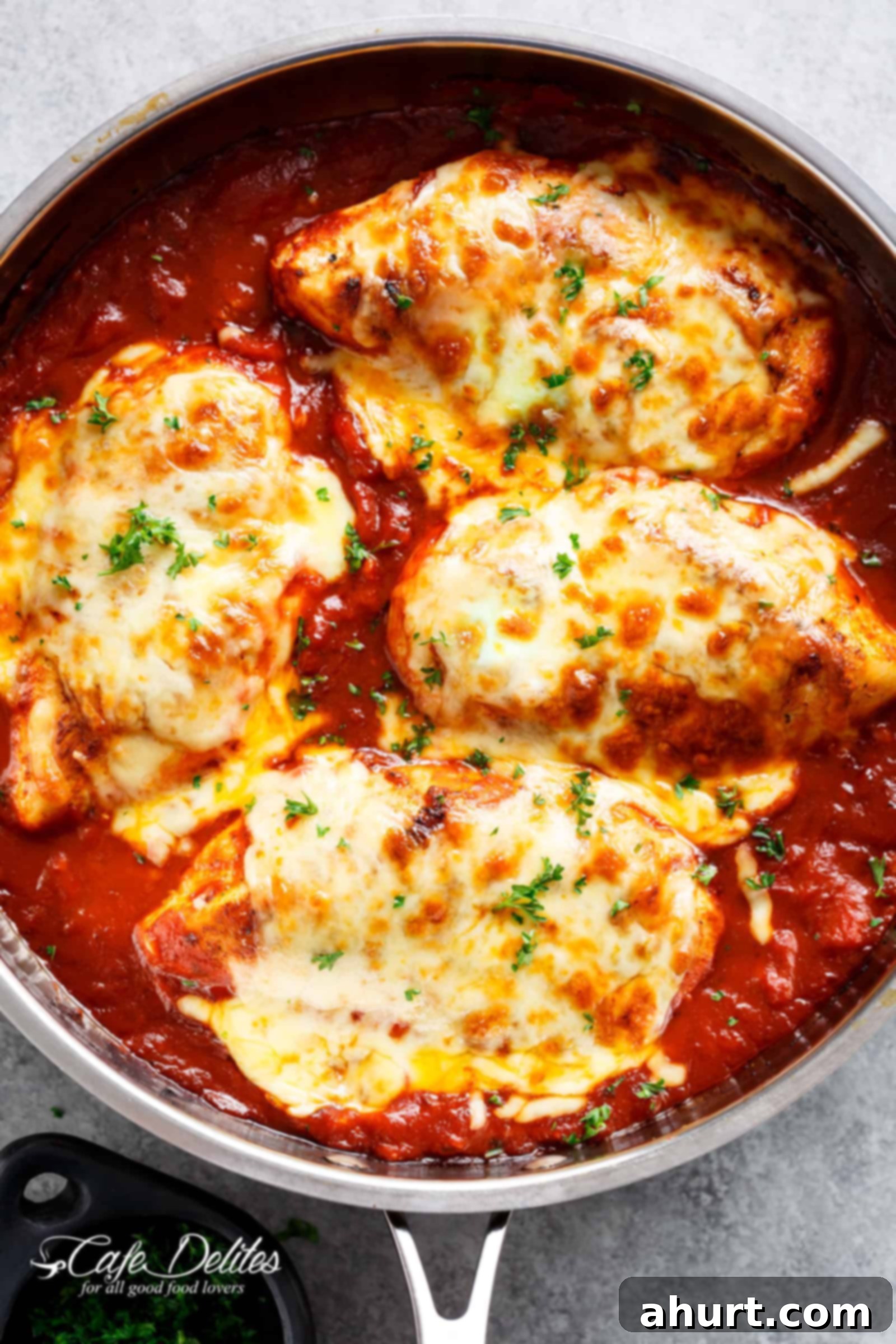 Golden Mozzarella Chicken Bake 2 Easy Mozzarella Chicken with rich tomato sauce and melted cheese, ready to be served