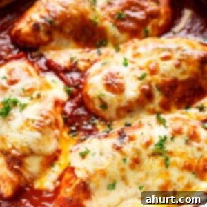Golden Mozzarella Chicken Bake 13 Easy Mozzarella Chicken in a bowl, garnished with fresh parsley.