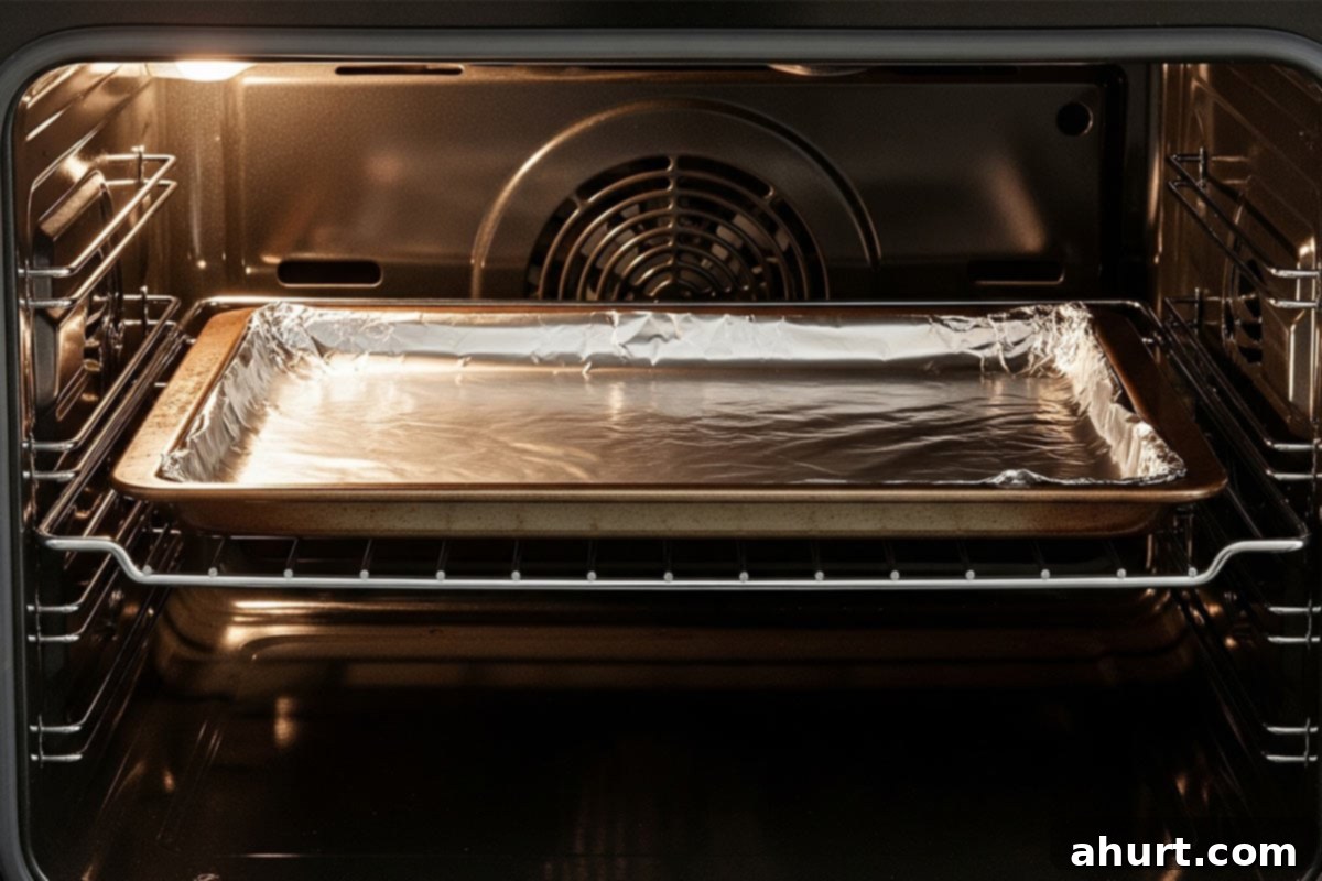 Succulent Broiled Lobster Tails 4 Baking sheet with foil inside the oven.