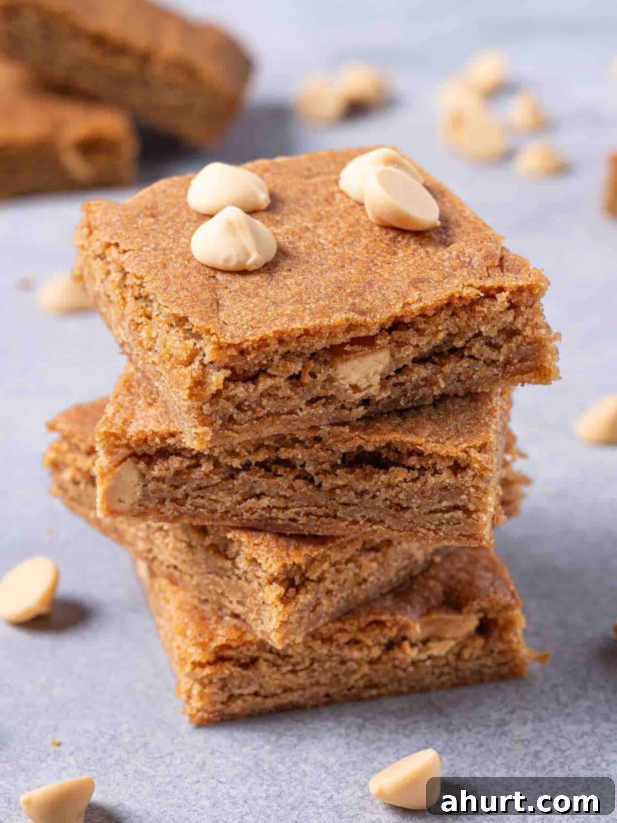 Luxurious White Chocolate Blondie Delights 2 Three beautiful blondies stacked together with white caramel on top.