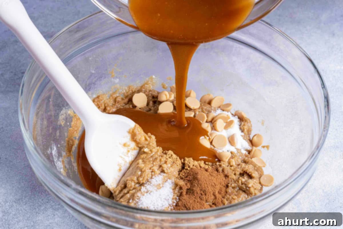 Luxurious White Chocolate Blondie Delights 6 Flour and baking powder being added to the mixture of ingredients.