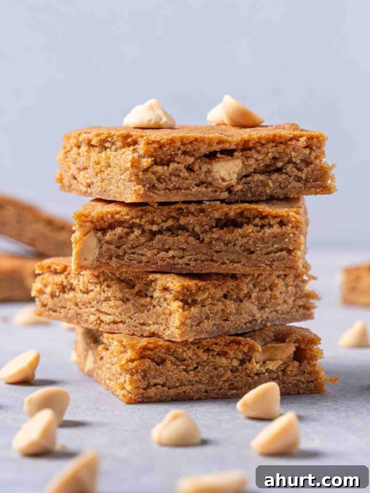 Luxurious White Chocolate Blondie Delights 8 Close-up shot of a finished White Chocolate Blondie surrounded by caramel chips.