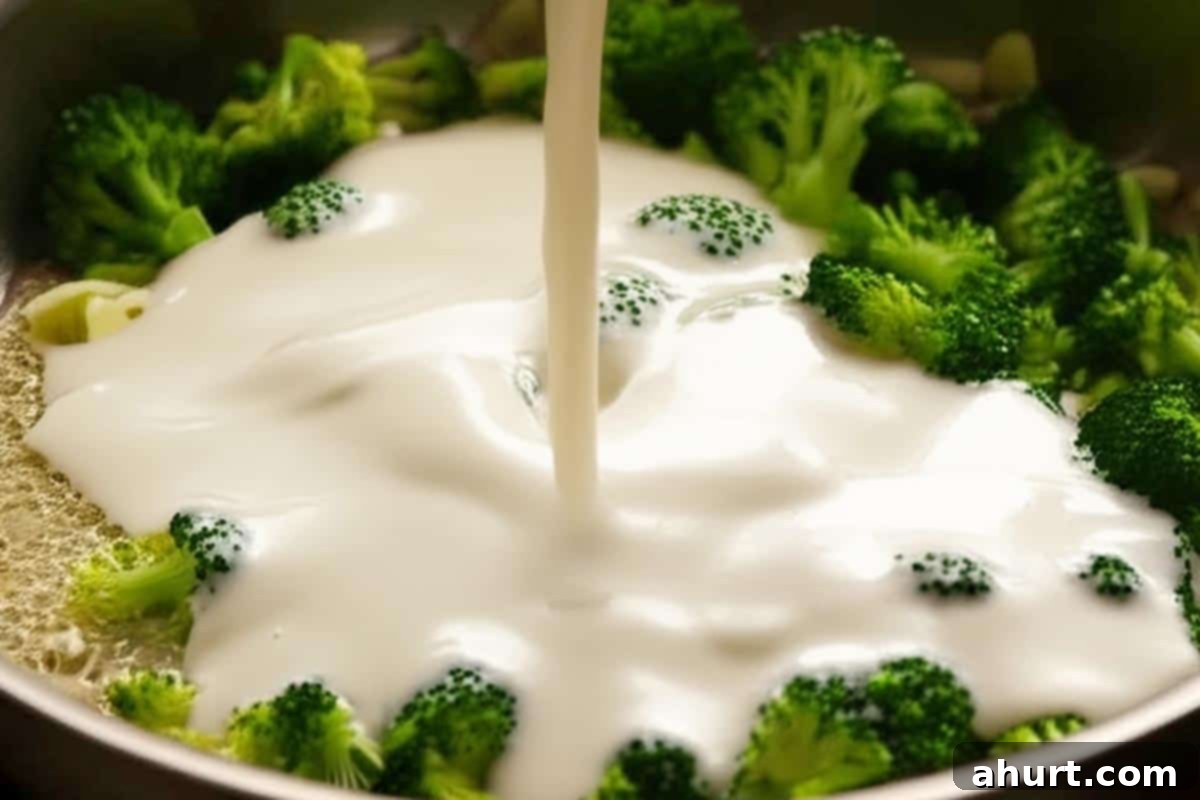 Creamy Broccoli and Bacon 8 Pouring in the cream over the broccoli.