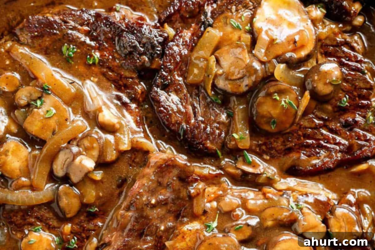 Savory Steaks with Velvety Mushroom Gravy 11 Close-up shot of Steaks With Mushroom Gravy.