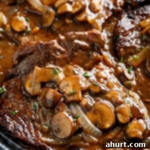 Savory Steaks with Velvety Mushroom Gravy 13 Ribeye Steaks With Mushroom Gravy in a pan