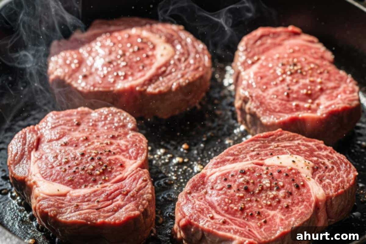 Savory Steaks with Velvety Mushroom Gravy 5 Searing steaks in a skillet.