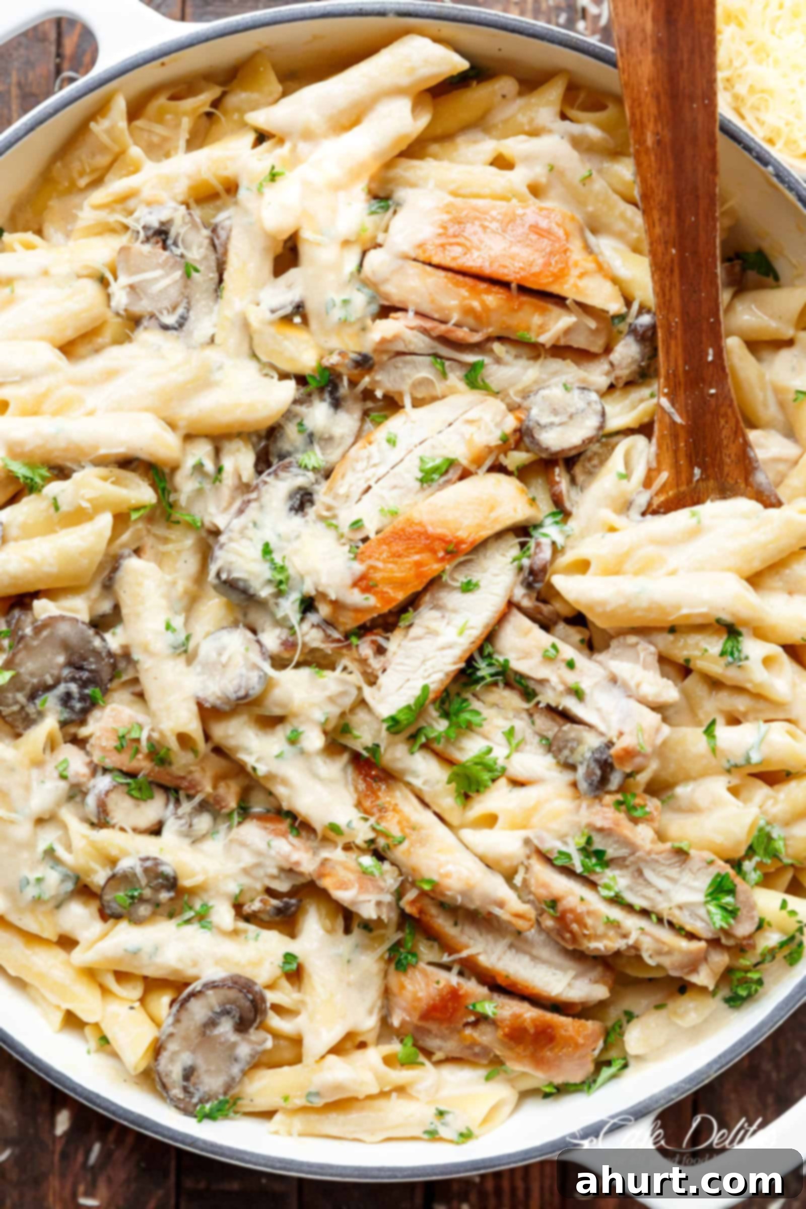 Velvet Chicken Alfredo Pasta 2 Creamy Garlic Parmesan Chicken Alfredo served in a bowl, showing seared chicken, creamy pasta, and green herbs, ready in under 20 minutes in one pot. This is a favorite chicken alfredo recipe.