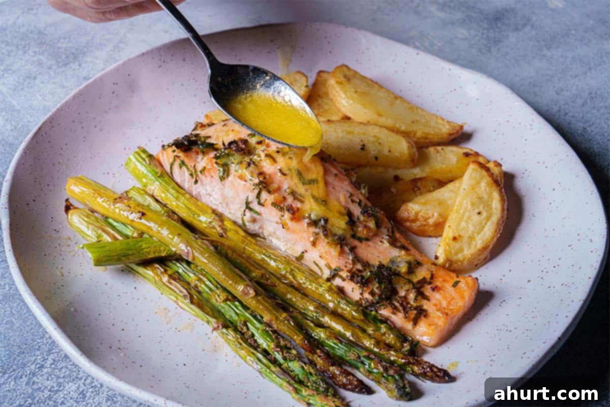 Decadent Garlic Butter Salmon 9 Perfectly cooked salmon with charred edges, sprinkled with sauce, ready to be served.
