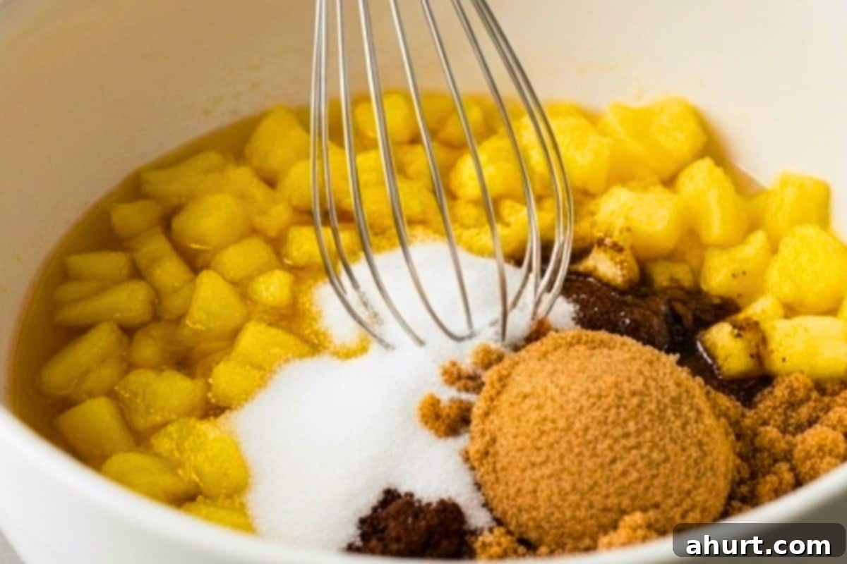 Golden Spiced Carrot Cake 6 Whisk the oil, pineapple, both sugars (white and brown) and vanilla in a bowl.
