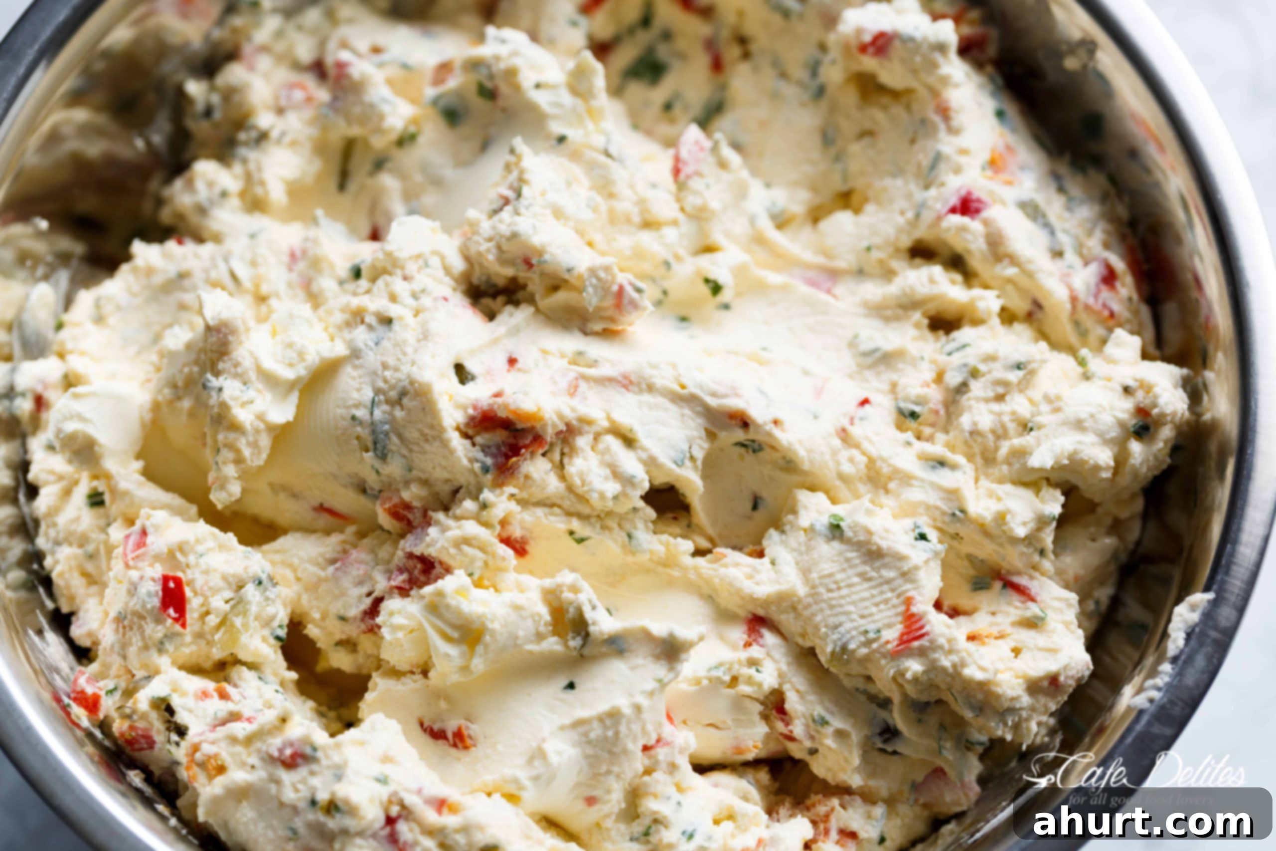 Cheese Ball Antipasto | cafedelites.com Cream cheese dip Christmas tree! - This image shows the cheese ball mixture being formed with plastic wrap, not a Christmas tree