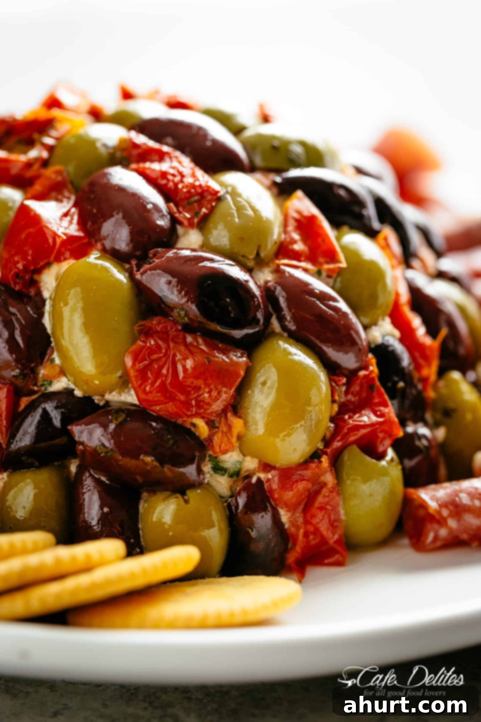 Antipasto | cafedelites.com Zoomed-in image of Antipasto Cheese Ball on a plate, highlighting textures