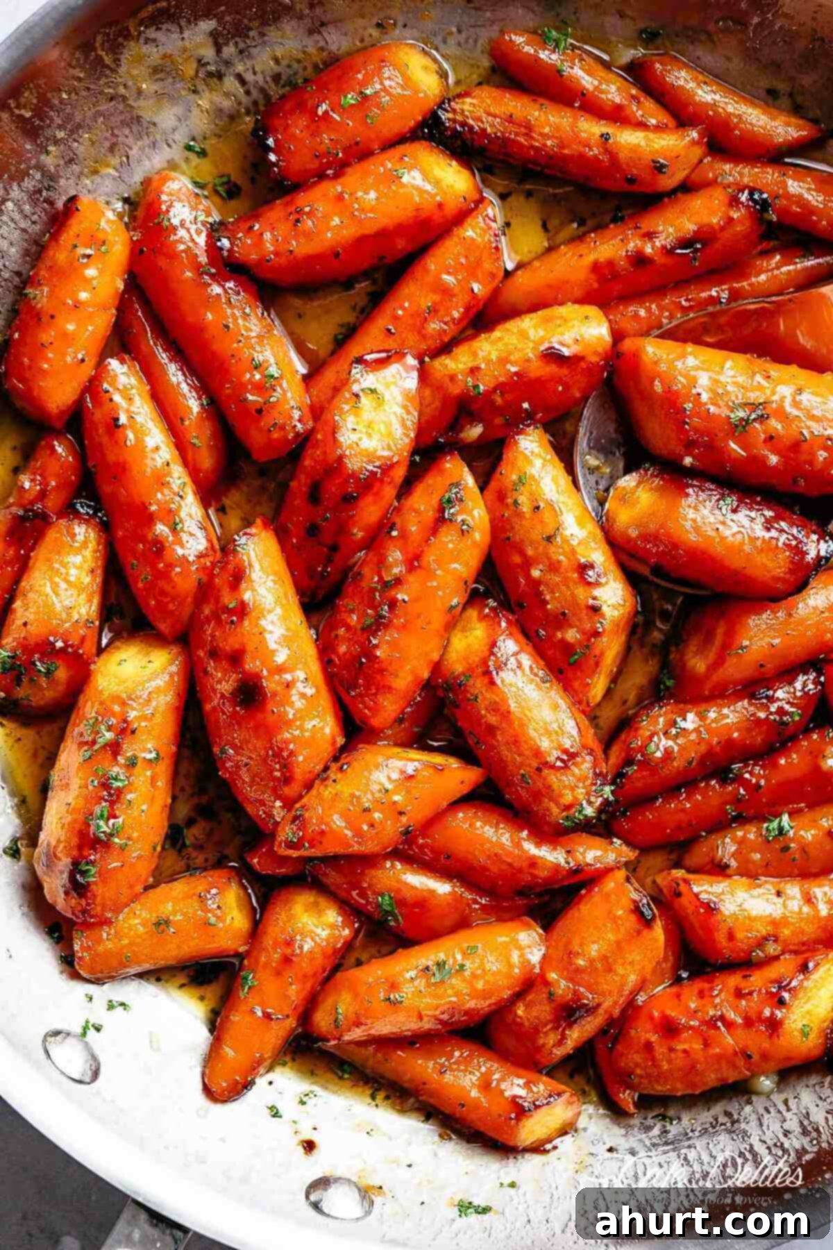 Golden Honey Garlic Butter Carrots 12 Close up image of roasted carrots coated in honey garlic butter sauce.