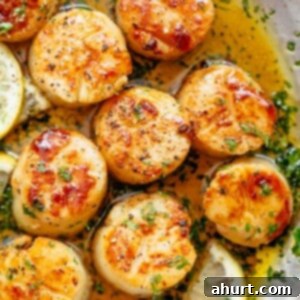 Pan-Seared Golden Garlic Butter Scallops 10 Lemon Garlic Butter Scallops on a pan